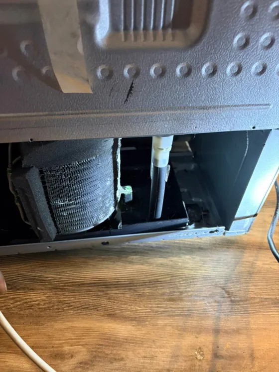 Refrigerator condenser coil, underneath, from a Tech Parker job